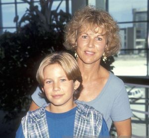 An Image of Jonathan Taylor Thomas and his mother