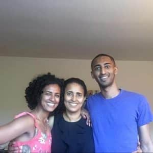 Hermela Aregawi with her mother and brother