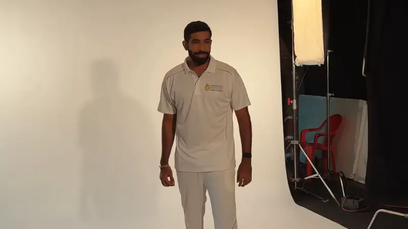 Top 10 Cricketers Everyone Talked About in 2025 2 Jasprit Bumrah poses in front of a white backdrop during a professional photoshoot