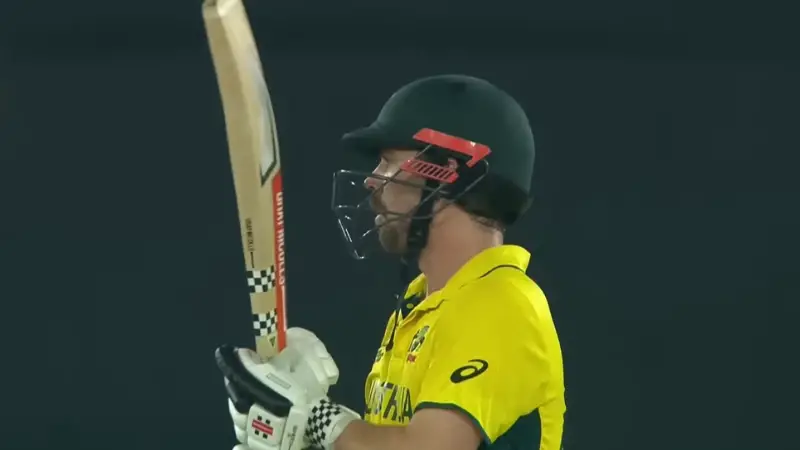 Top 10 Cricketers Everyone Talked About in 2025 5 Travis Head stands focused at the crease in Australia’s yellow kit