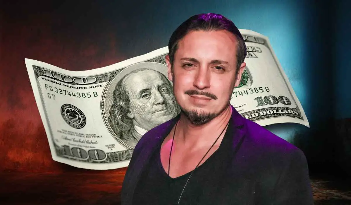 Peter Madrigal standing in front of a background with a large $100 bill illustration