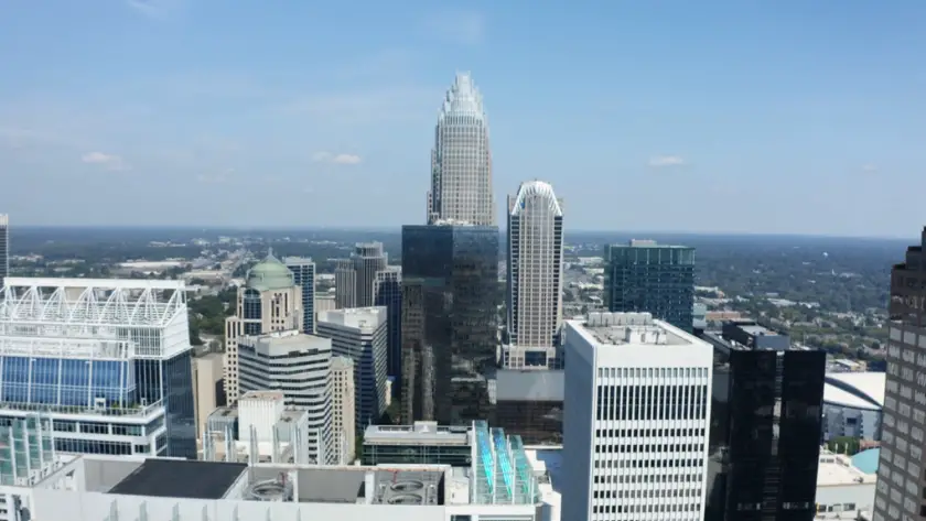 A skyline view of downtown Charlotte with tall office buildings and clear weather