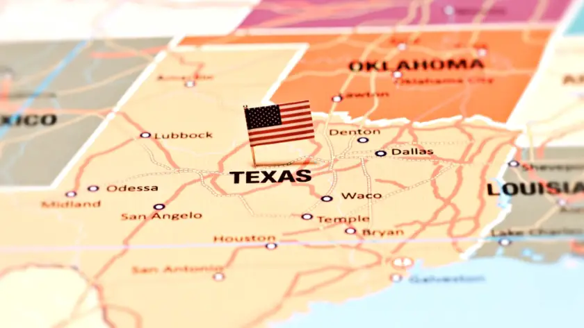A map highlights Texas with a small US flag placed on the state