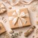 Elegant flat lay of a large wrapped gift with a soft ribbon, surrounded by neutral-toned decorative elements