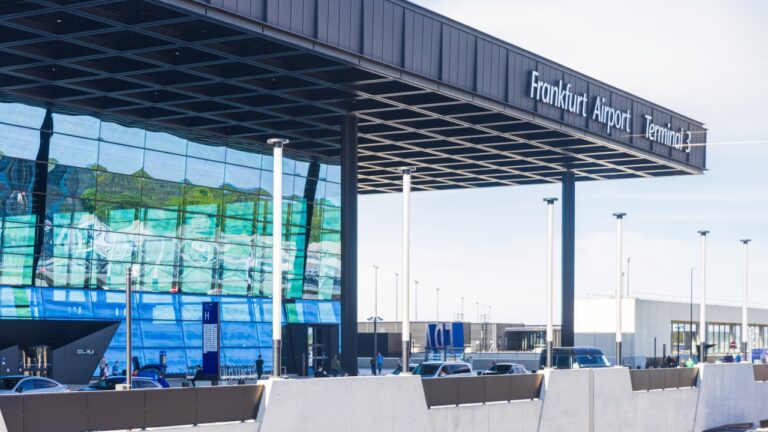 Frankfurt Airport terminal exterior with cars outside the entrance