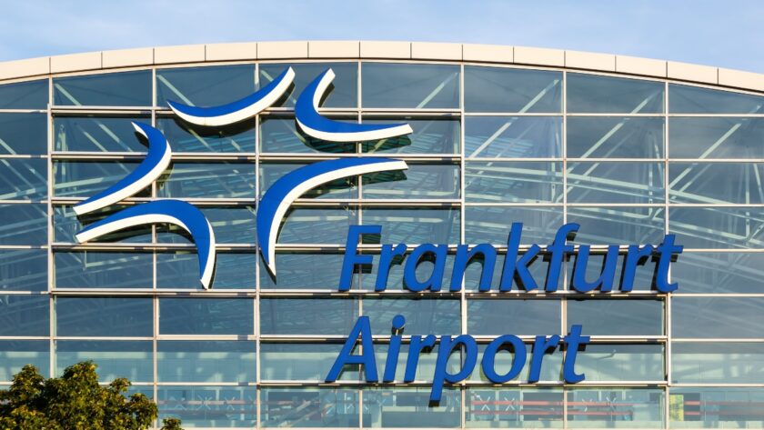Frankfurt Airport sign on a glass terminal facade